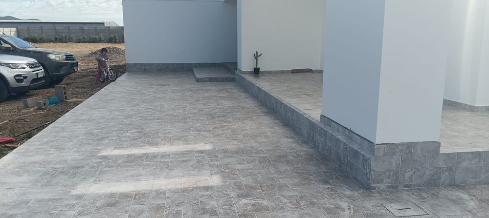 Obra de cliente: Rapolano Stone 56x56 en terraza - La Casa de la Cerámica
